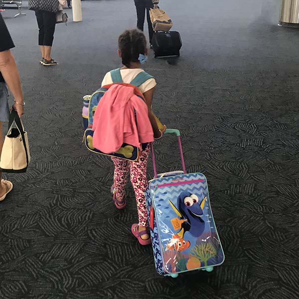 Child walking in airport