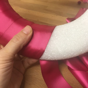 Wrapping wreath with ribbon